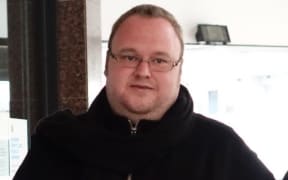 Kim Dotcom leaving court.