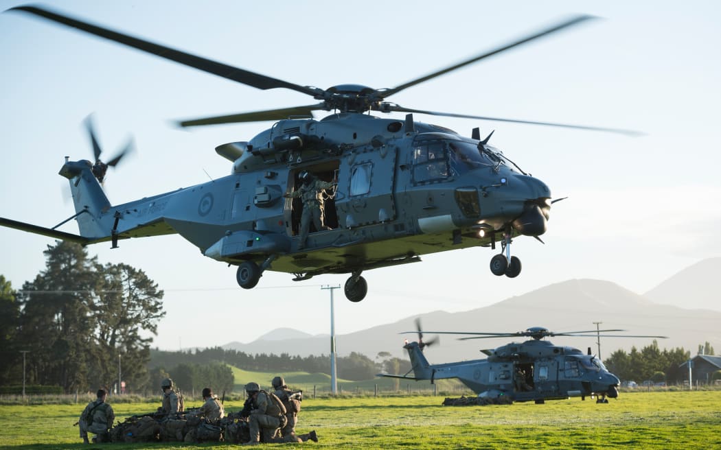 Two NH90 helicopters of the Royal New Zealand Air Force touch down and release New Zealand Army soldiers to secure an area in the town of Ward, as part of exercise Southern Katipo.