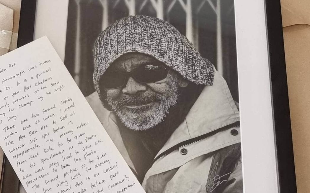 Portrait of Allan Adams with note from mystery photographer