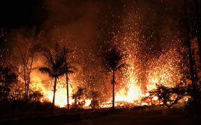 A volcanic fissure with lava fountains as high as about 70m in Leilani Estates, Hawaii.