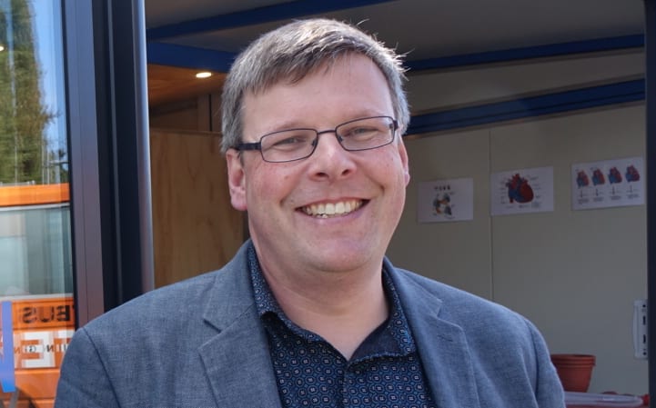 Associate Professor Peter Dearden, director of Genetics Otago, who dreamed up and has led the project, in front of the lab at Kaikorai Primary School.