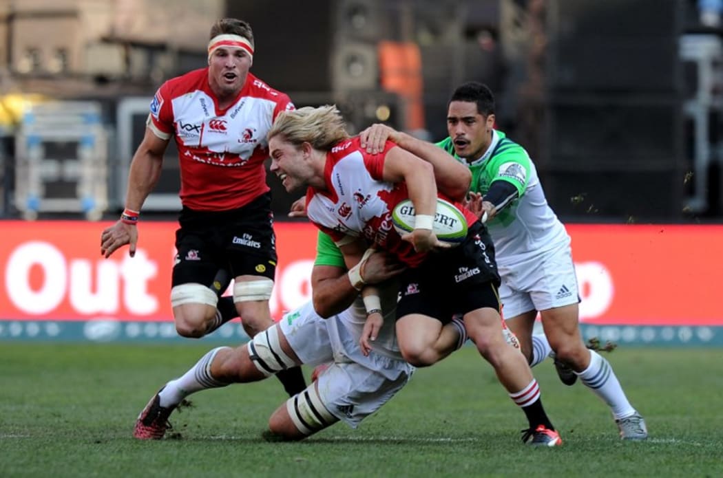 Faf de Klerk is tackled by Aaron Smith during the semi-final match.