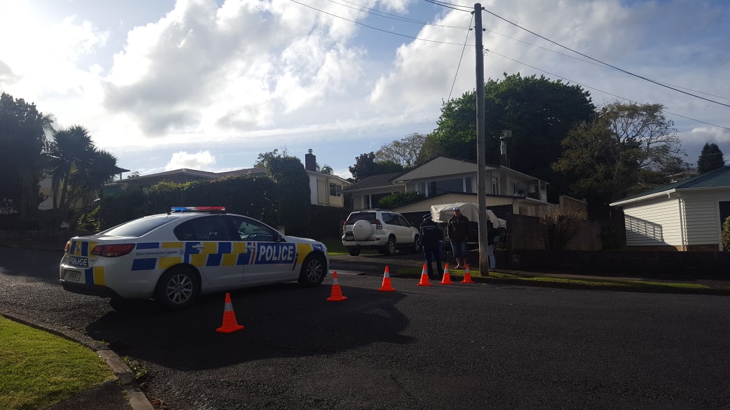 Police at the cordon in Whangarei where one person died and another was critically injured.