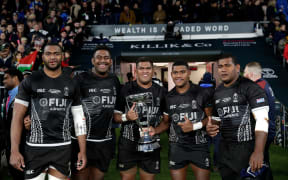 Mesulame Kunavula, Temo Mayanavanua, Veremalua Vugakoto, Peni Matawalu and Joeli Veitayaki celebrate Fiji's Killik Cup win over the Barbarians.