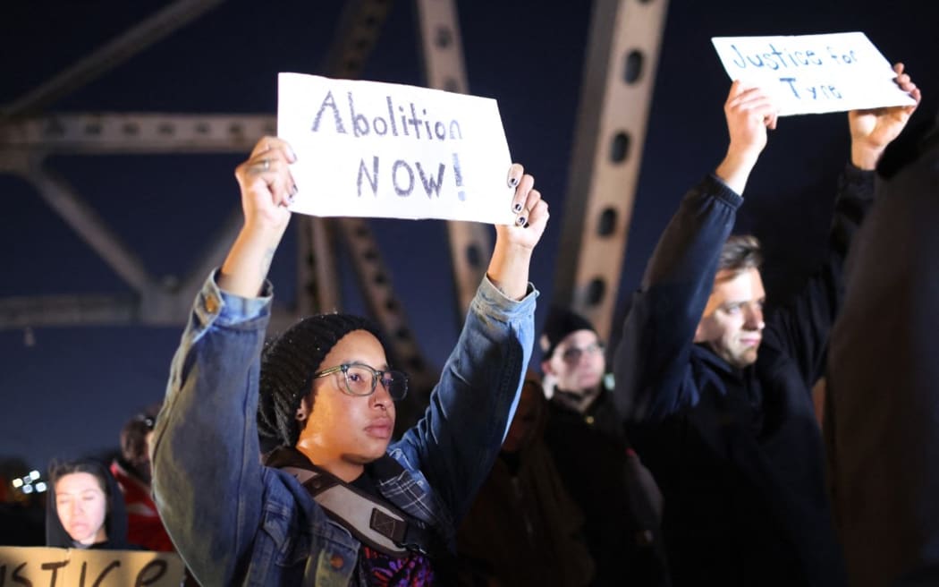 MEMPHIS, TENNESSEE - JANUARY 27: Demonstrators block traffic on Interstate 55 while protesting the death of Tyre Nichols on January 27, 2023 in Memphis, Tennessee. The release of a video depicting the fatal beating of Nichols, a 29-year-old Black man, sparked protests in cities throughout the country. Nichols was violently beaten for three minutes and killed by Memphis police officers earlier this month after a traffic stop. Five Black Memphis Police officers have been fired after an internal investigation found them to be “directly responsible” for the beating and have been charged with “second-degree murder, aggravated assault, two charges of aggravated kidnapping, two charges of official misconduct and one charge of official oppression.”   Scott Olson/Getty Images/AFP (Photo by SCOTT OLSON / GETTY IMAGES NORTH AMERICA / Getty Images via AFP)