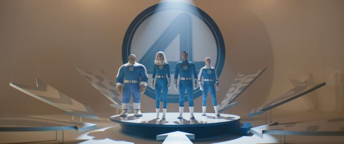 Marvel film Fantastic Four: First Steps actors Ebon Moss-Bachrach, Vanessa Kirby, Pedro Pascal, Joseph Quinn stand in the spotlight in their suits.
