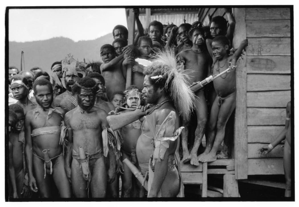 Highland crowd watch a pigfeast and flag-raising ceremony conducted by OPM guerillas, West Papua / Indonesia 1995