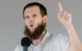Islamist preacher Sven Lau aka "Abu Adam" talks during a rally on July 19, 2014 in Hamburg, northern Germany. AFP PHOTO / DPA / MARKUS SCHOLZ / GERMANY OUT