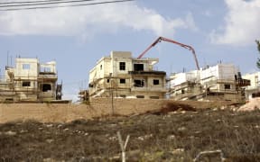 This file photo taken on October 13, 2021, shows construction in the Israeli settlement of Rahalim, located near the village of Yatma, south of Nablus in the occupied West Bank.
