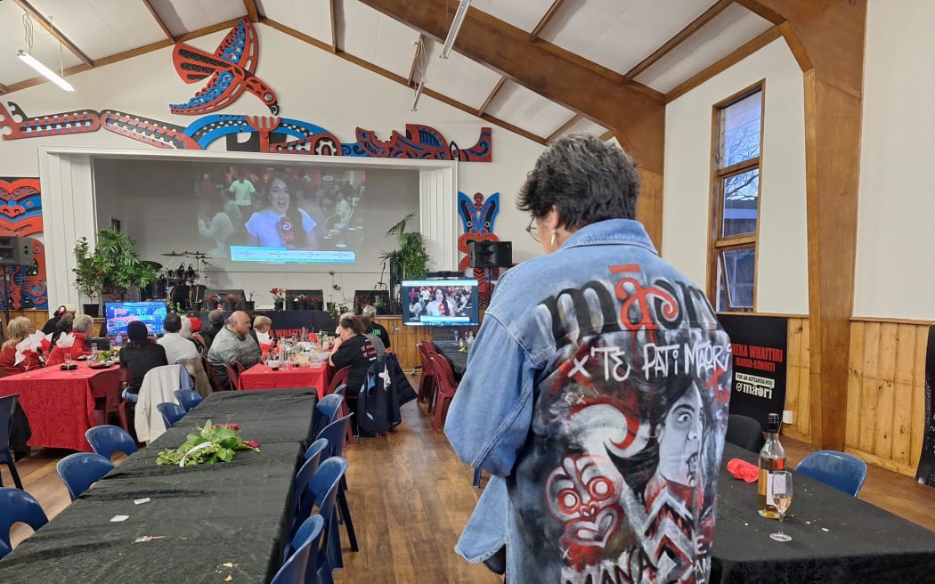 Meka Whaitiri is sporting her one of a kind Te Pāti Māori denim jacket, which she bought at an auction, made by a Gisborne artist.