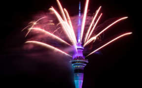 The Sky Tower lit up with an impressive fireworks display.