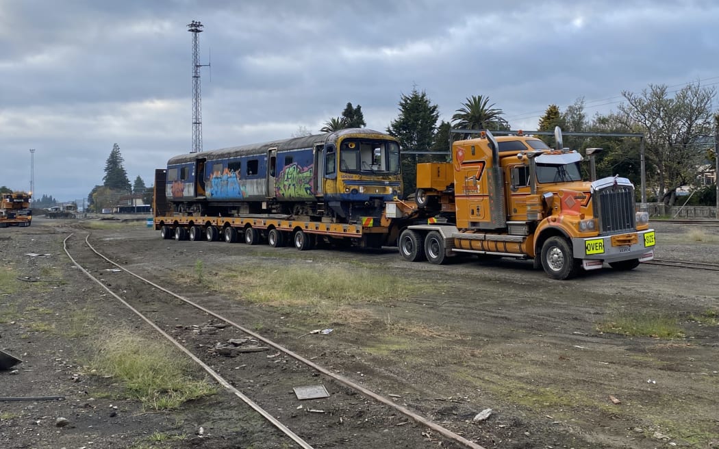 One of the last Auckland Transport carriages is trucked out of Taumarunui.