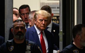 Former US President Donald Trump makes his way inside the Manhattan Criminal Courthouse in New York on April 4, 2023. - Donald Trump will make an unprecedented appearance before a New York judge on April 4, 2023 to answer criminal charges that threaten to throw the 2024 White House race into turmoil. (Photo by Ed JONES / AFP)