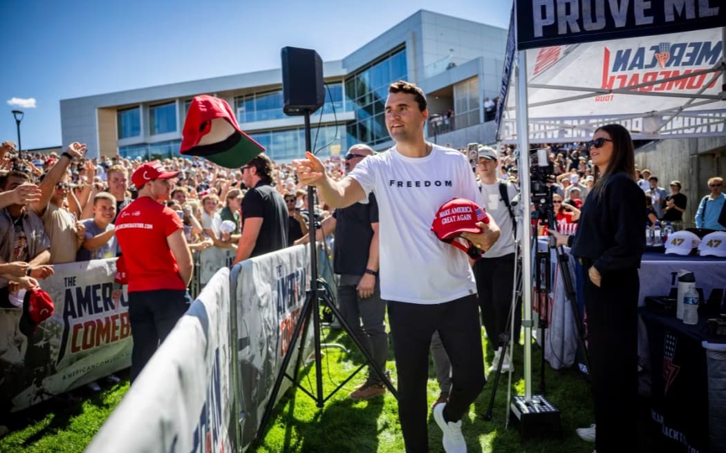 Charlie Kirk hands out hats before speaking at Utah Valley University in Orem, Utah, on 10 September.