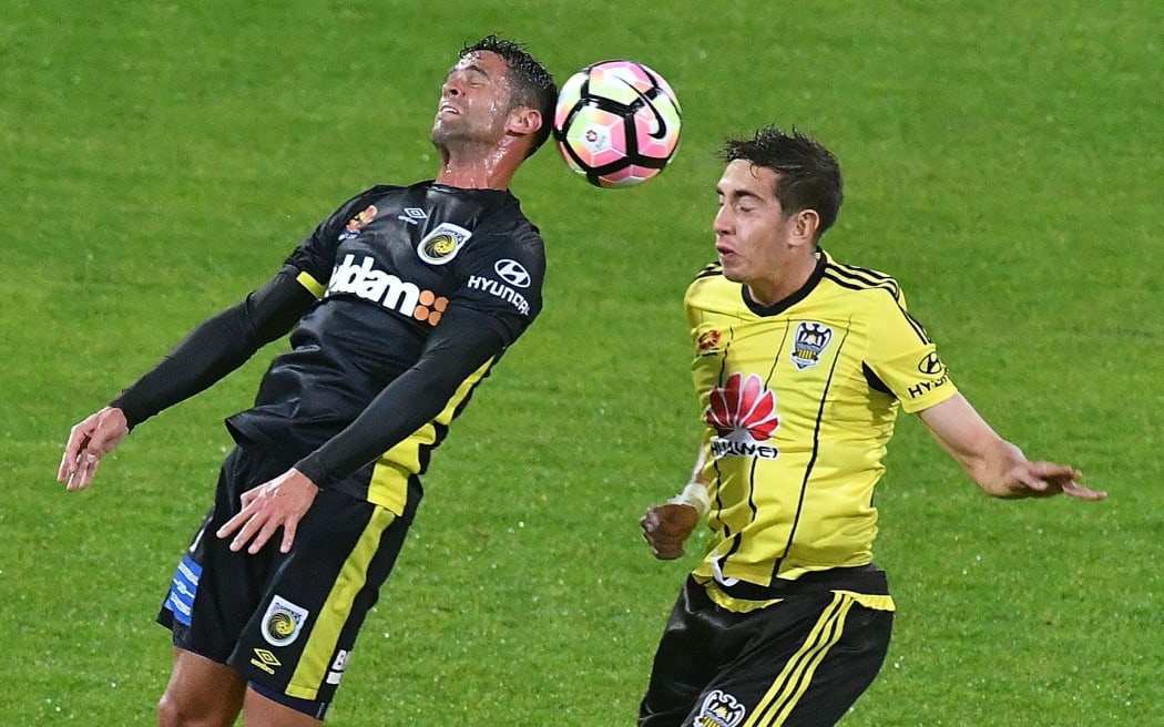 New Phoenix signing Scott Galloway (left), playing for the Central Coast Mariners,  contests the ball with the Phoenix's Alex Rodriguez.