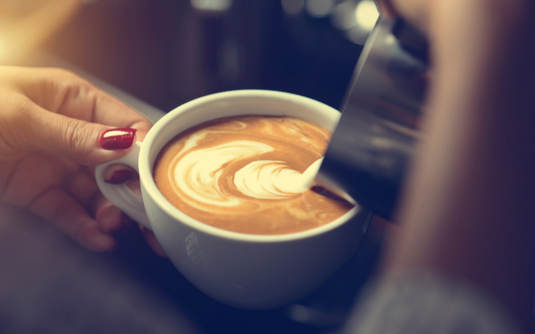 barista making coffee