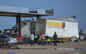 Damage is seen at a truck stop the morning after a tornado rolled through, Sunday, 26 May 2024, in Valley View, Texas.