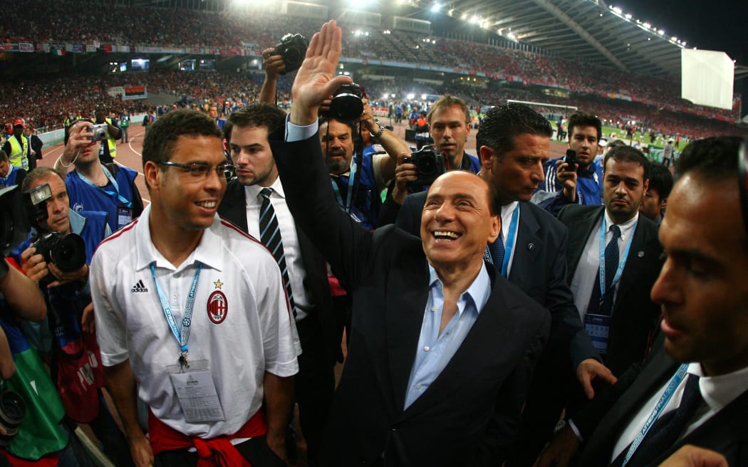 AC Milan's president Silvio Berlusconi (R) and Brazilian football star Ronaldo (L) arrive for the Champions League final football match against Liverpool at the Olympic Stadium, in Athens, 2007.