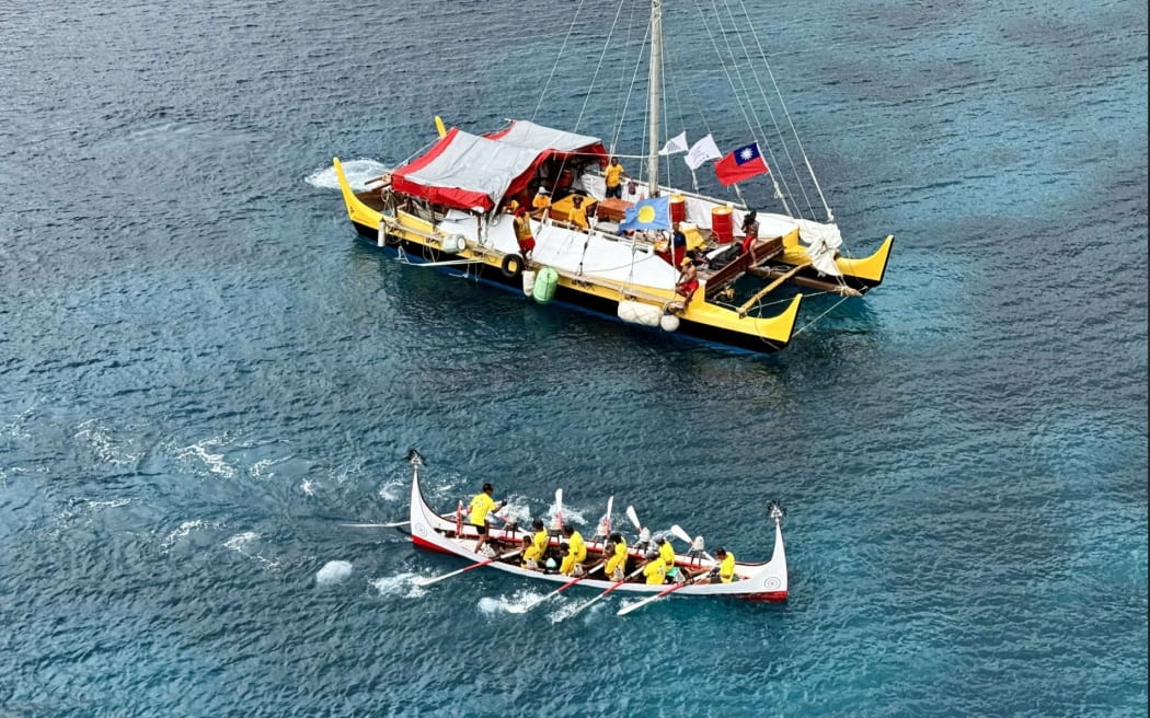 The voyagers celebrating arrival in Palau.