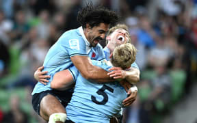 Charlie Gamble of the Waratahs (left) joins Hugh Sinclair of the Waratahs (right) as he celebrates scoring a try during the Super Rugby Pacific Round 2 match between the Crusaders and the New South Wales Waratahs at AAMI Park in Melbourne, Saturday, March 2, 2024. (AAP Image/Joel Carrett/ Photosport