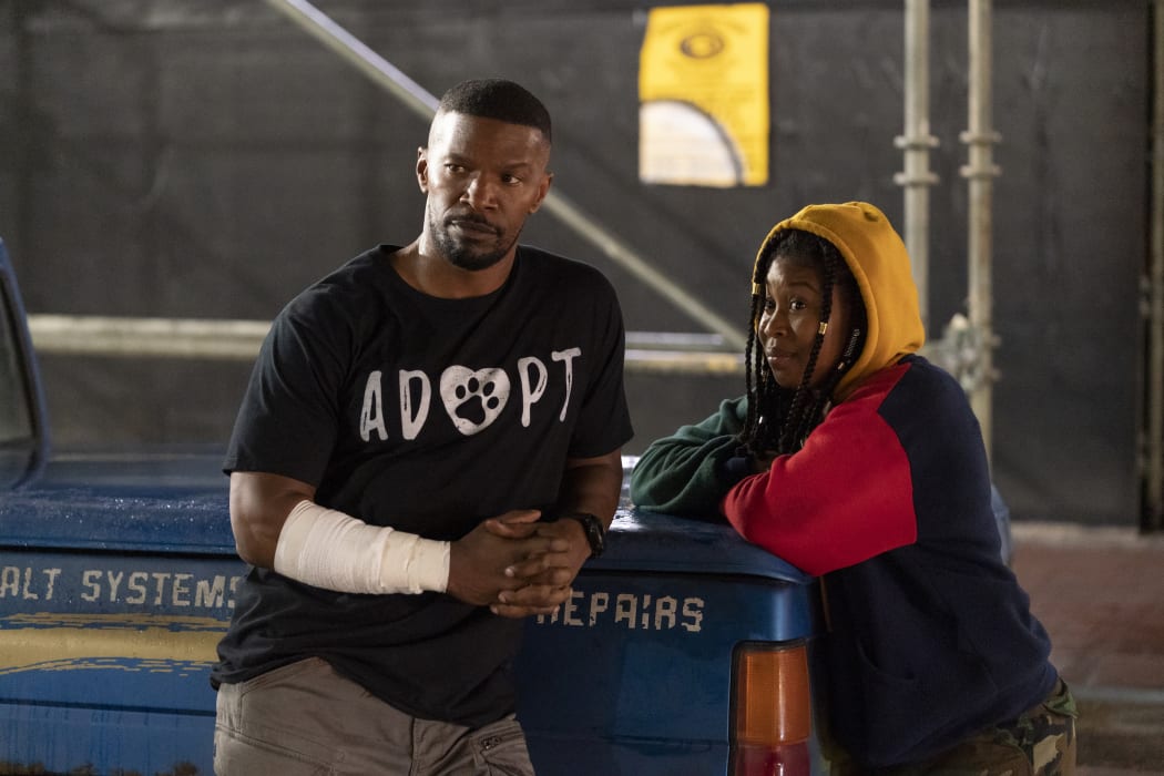 Jamie Foxx as Art (The Major) and Dominique Fishback as Robin in Project Power.