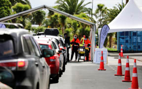 People waiting for their turn at the drive-through vaccination centre at The Trusts Arena, Auckland.