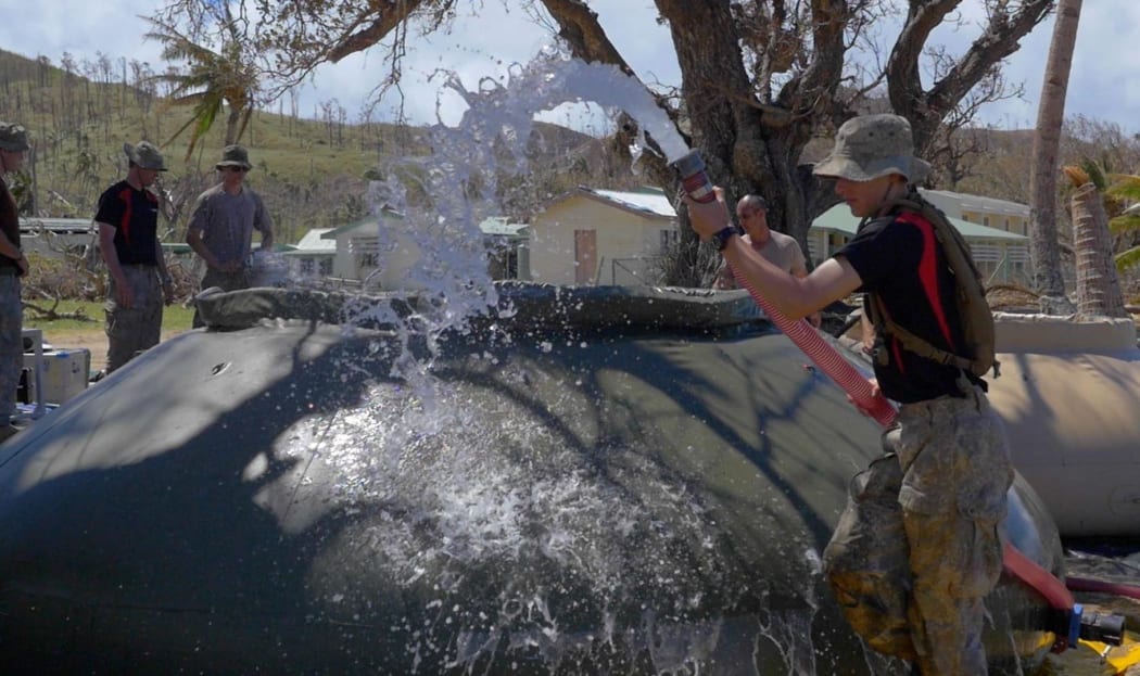 NZ Defence Force sappers install a reverse osmosis system to convert seawater into drinking water to support the NZ contingent and to provide potable water to Lomaloma residents.
