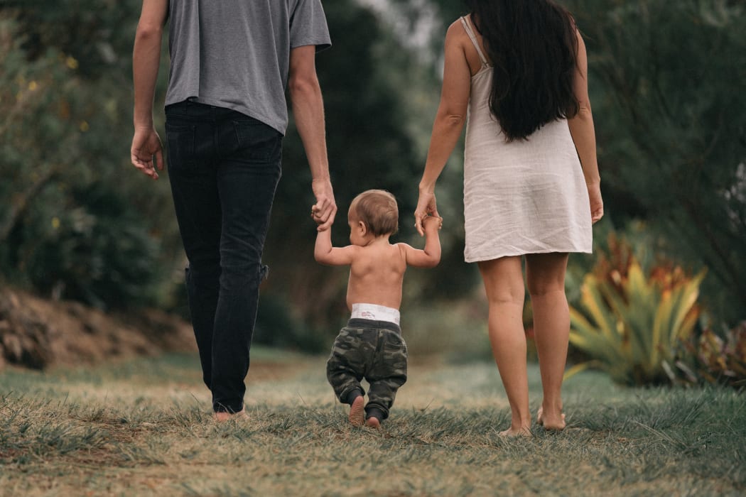 couple walking baby