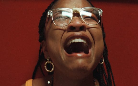 Movie still from the 2023 horror film The Angry Black Girl and Her Monster