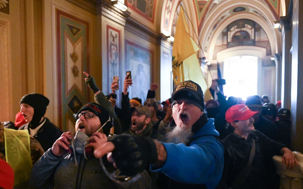 Rioters breached security and entered the Capitol on 6 January as Congress debated the 2020 presidential election Electoral Vote Certification.