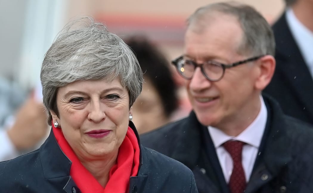Britain's Prime Minister Theresa May and her husband Philip May arrive at Kansai airport in Izumisano city, Osaka prefecture, on June 27, 2019 ahead of the G20 Osaka Summit.