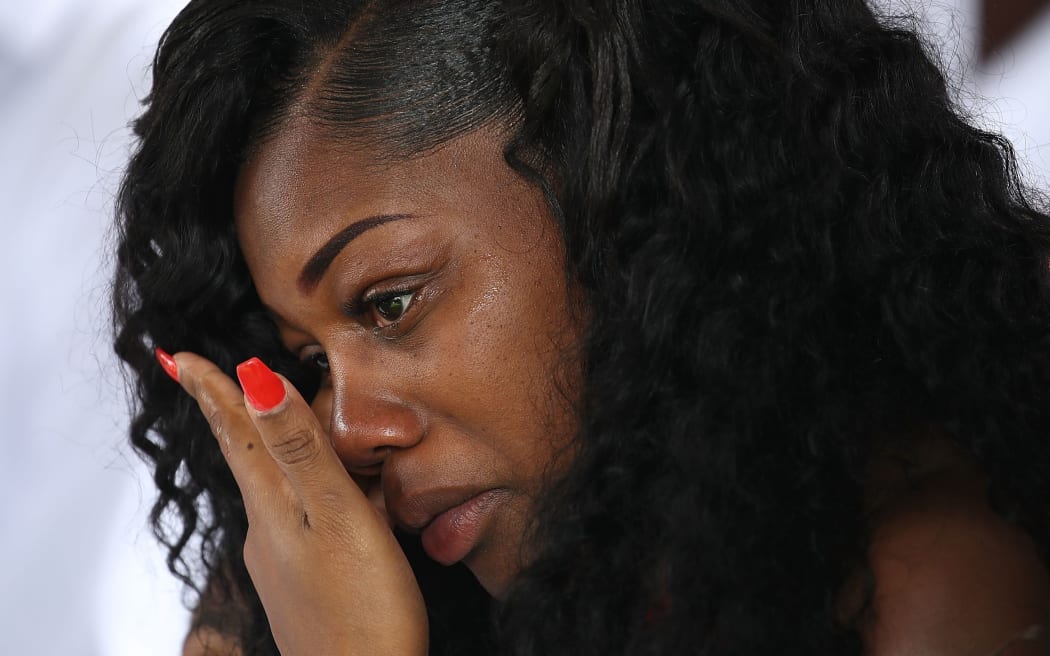 Myeshia Johnson wipes away tears during the burial service for her husband U.S. Army Sgt. La David Johnson at the Memorial Gardens East cemetery on October 21, 2017 in Hollywood, Florida.