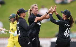 White Fern Molly Penfold (C) celebrates dismissing Australia captain Alyssa Healy in a one-day international in Wellington.