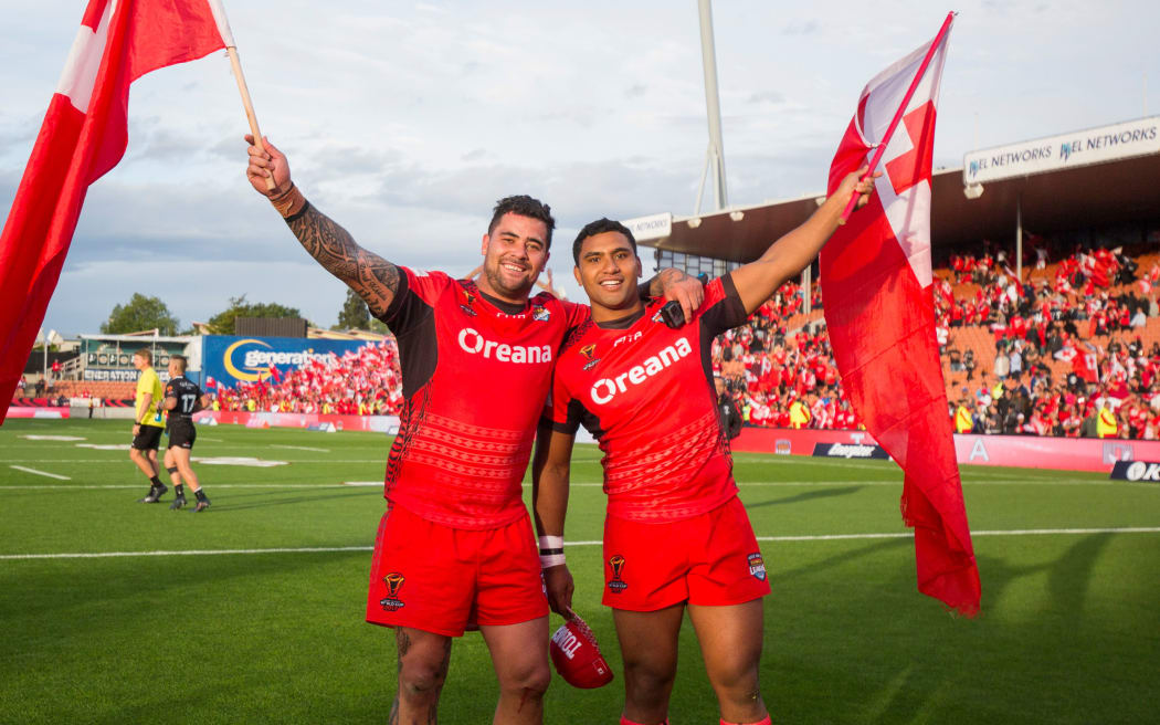 Andrew Fifita, (left) and Tevita Pangai Junior celebrate a win during the 2017 World Cup