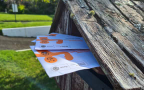 Easy vote envelope packs in the mail for the 2023 general election.