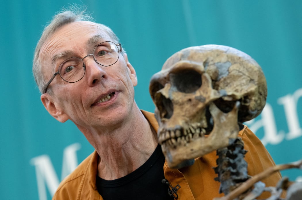 Swedish evolutionary researcher Svante Pääbo, who has been awarded the Nobel Prize in Medicine or Physiology, stands next to a replica of a Neanderthal skeleton at the Max Planck Institute for Evolutionary Anthropology in Leipzig, 3 October 2022.