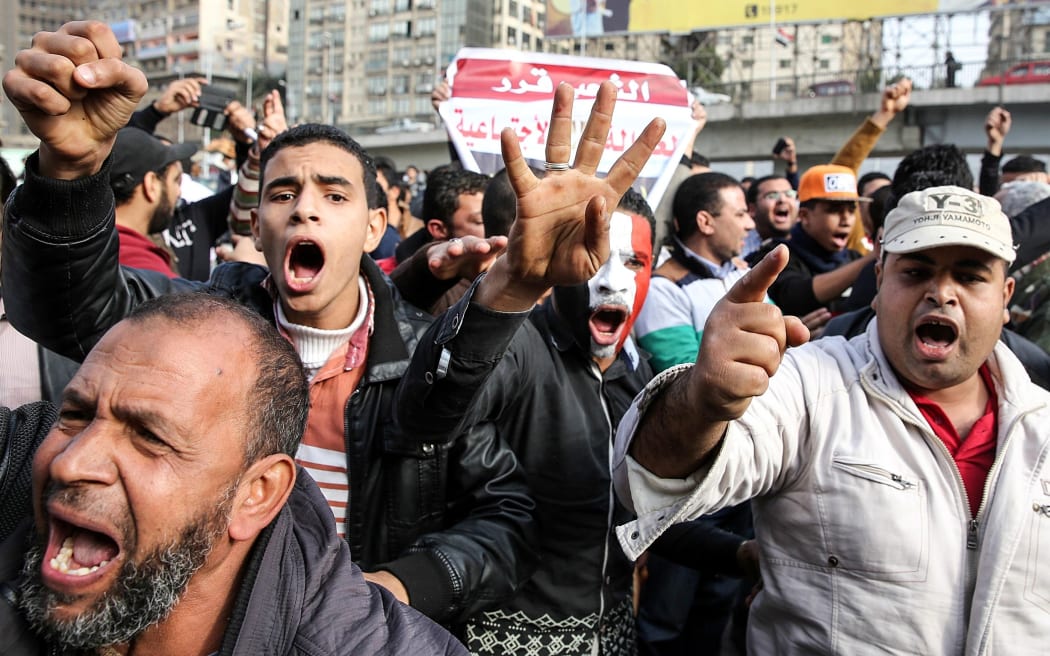 Egyptians calling themselves "anti-coup" march as pro-government Egyptians hold a counter demonstration in Cairo, on the fourth anniversary of the 2011 uprising.