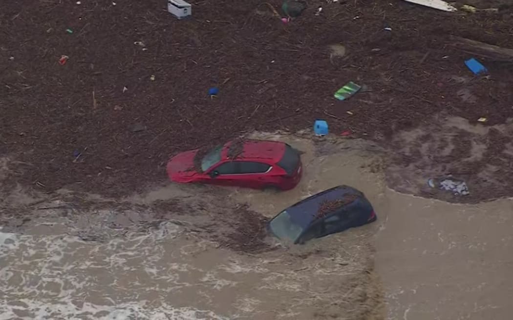 Cars were swept out to sea, and a caravan park was flooded after torrential rain battered communities along Victoria's Great Ocean Road.