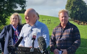 National Party leader Christopher Luxon, centre, with MPs Judith Collins and Todd McClay, announces the party's new farming package, 19 April 2023.