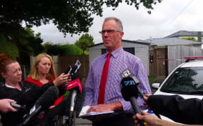Detective Senior Sergeant Roger Small at the house where 69-year-old Cun Xiu Tian was killed.