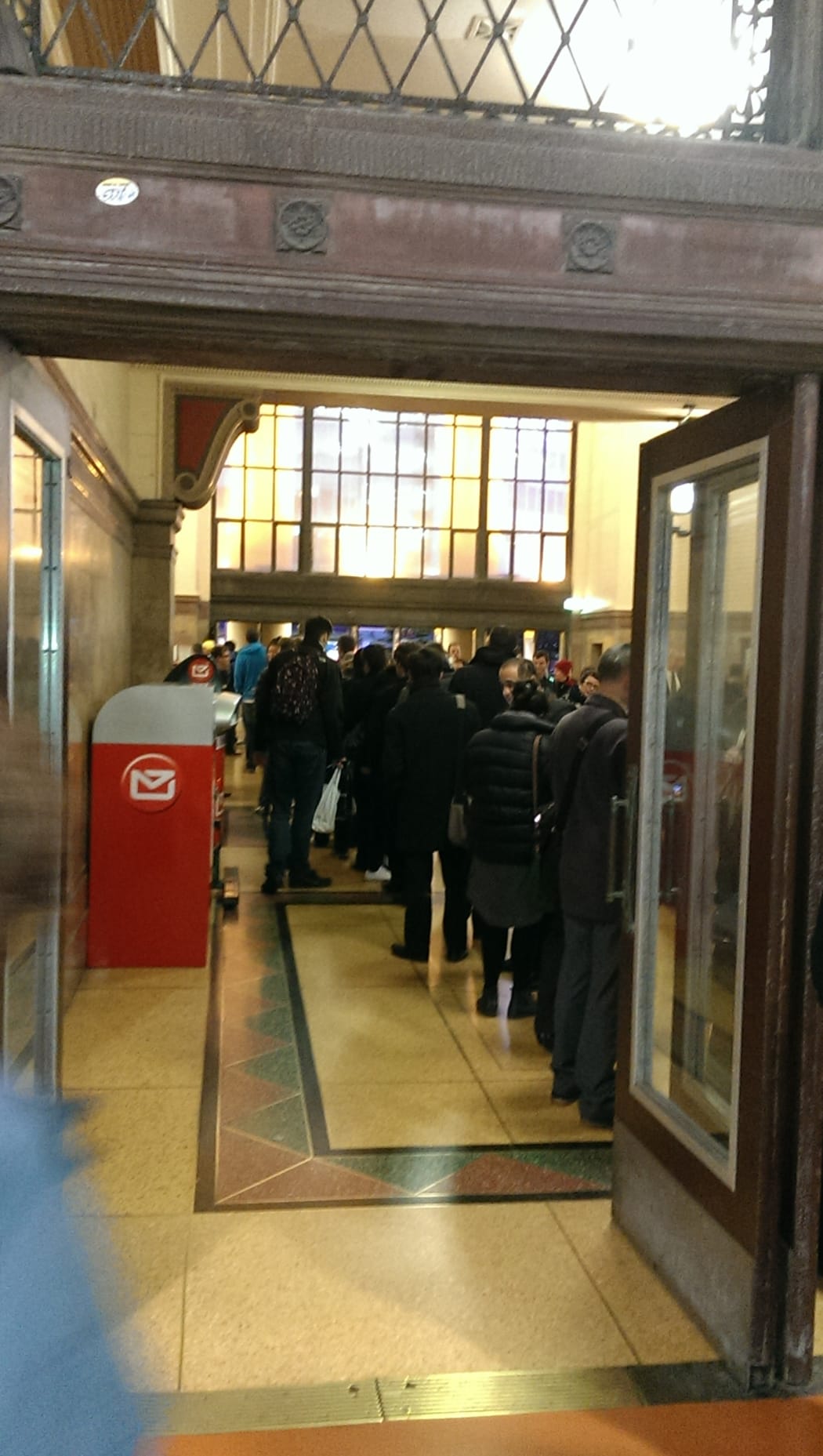 Fans queue at Ticketek at the Wellington Railway Station.