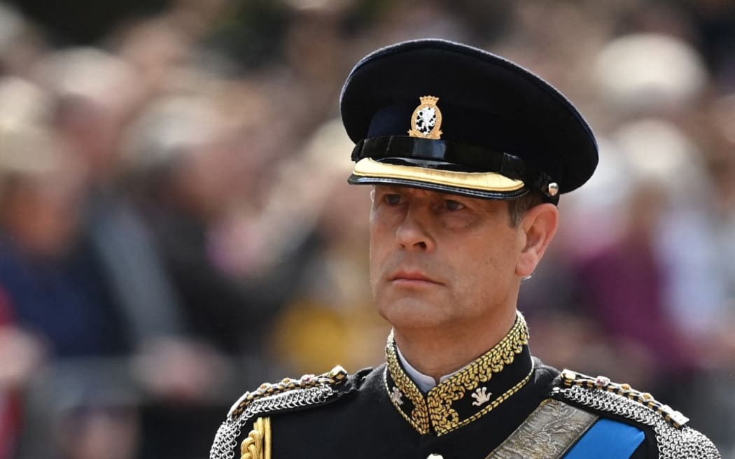 (FILES) In this file photo taken on September 14, 2022 Prince Edward, Earl of Wessex walks behind the coffin of Queen Elizabeth II, adorned with a Royal Standard and the Imperial State Crown and pulled by a Gun Carriage of The King's Troop Royal Horse Artillery, during a procession from Buckingham Palace to the Palace of Westminster, in London. - Britain's Prince Edward, Earl of Wessex, the younger brother of King Charles III, will take over the title of Duke of Edinburgh from Prince Philip, husband of Queen Elizabeth II, until his death in 2021, Buckingham Palace announced on March 10, 2023. (Photo by Kate Green / POOL / AFP)