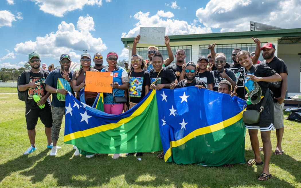 The match included touching tributes to Valerie Kalkoa.  Spectators holding signs and Vanuatu flags.