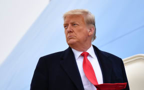 US President Donald Trump boards Air Force One before departing Harlingen, Texas on January 12, 2021.