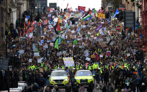 Young protesters take part in the Fridays For Future rally in Glasgow, Scotland on November 5, 2021, venue of the COP26 UN Climate Change Conference being held in the city. -