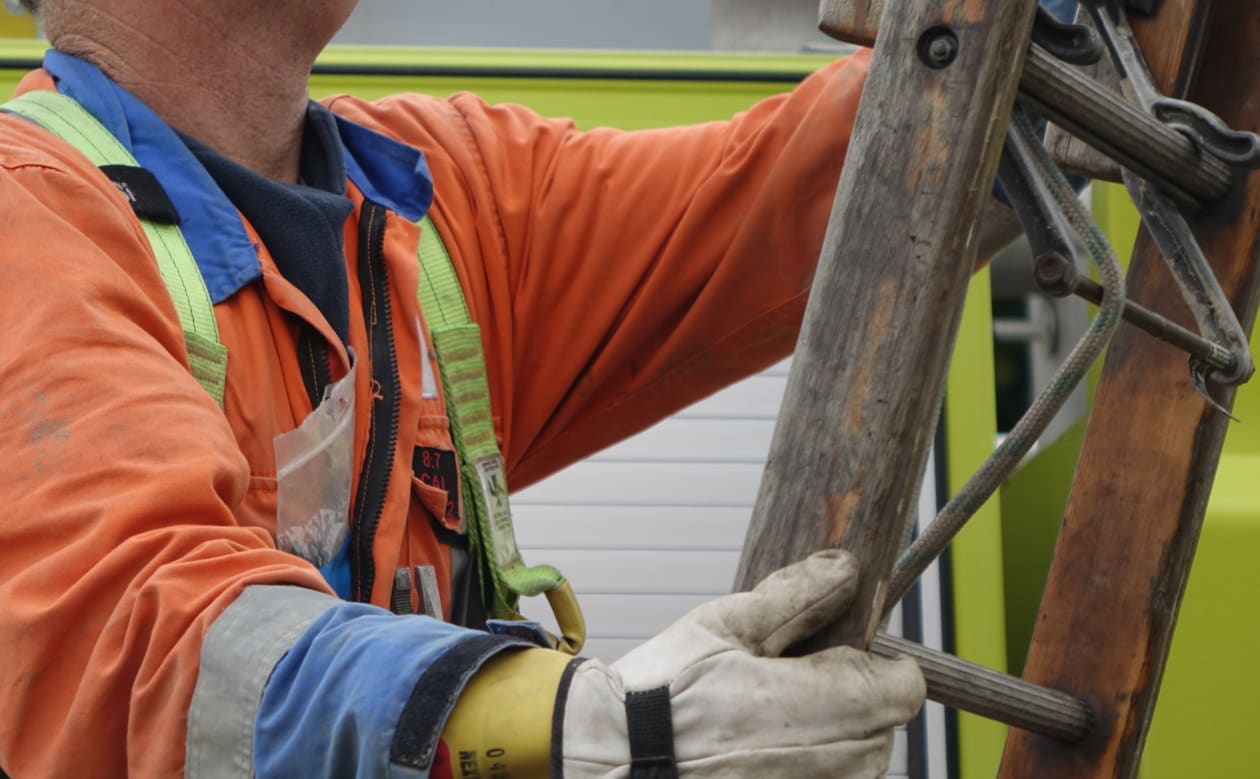 Linesman Andrew Henare works to check homes on Anzac Parade in Whanganui.