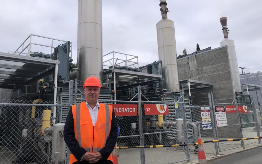Managing director of Waste Management, Evan Maehl, standing in front of the energy plant at the Redvale Landfill and Energy Park