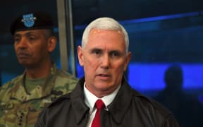 Mike Pence (right) speaks to the media as US General Vincent Brooks, Commander of the United Nations Command, Combined Forces Command and United States Forces Korea looks on.