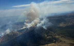 Firefighters are battling to contain a bushfire in Alpha Rd, Tambaroora, in New South Wales, Australia.
