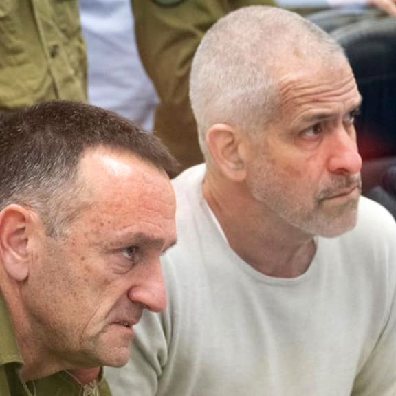 (FILES) This handout picture released by the Israeli army shows (L to R) Israeli army Chief of the General Staff Lieutenant-General Herzi Halevi and Israel Security Agency (ISA, also known as Shin Bet) director Ronen Bar at the Hostages and Missing Persons situation room during the return of the four hostages from Gaza on January 25, 2025. Israeli Prime Minister Benjamin Netanyahu said on March 16 that he was seeking to dismiss the head of Israel's internal security agency, who swiftly called the move political and said the premier expected "personal loyalty". Netanyahu and Shin Bet head Ronen Bar have been engaged in a public spat in recent weeks over reforms to the agency, which has been accused of failing to prevent the October 7, 2023 Hamas attack that triggered war in Gaza. (Photo by Israeli Army / AFP) / === RESTRICTED TO EDITORIAL USE - MANDATORY CREDIT "AFP PHOTO / HANDOUT / ISRAELI ARMY' - NO MARKETING NO ADVERTISING CAMPAIGNS - DISTRIBUTED AS A SERVICE TO CLIENTS ==